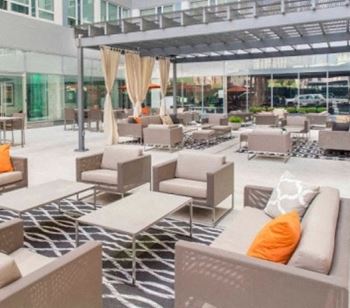 The resident courtyard featuring comfortable seating arrangements and fire pits